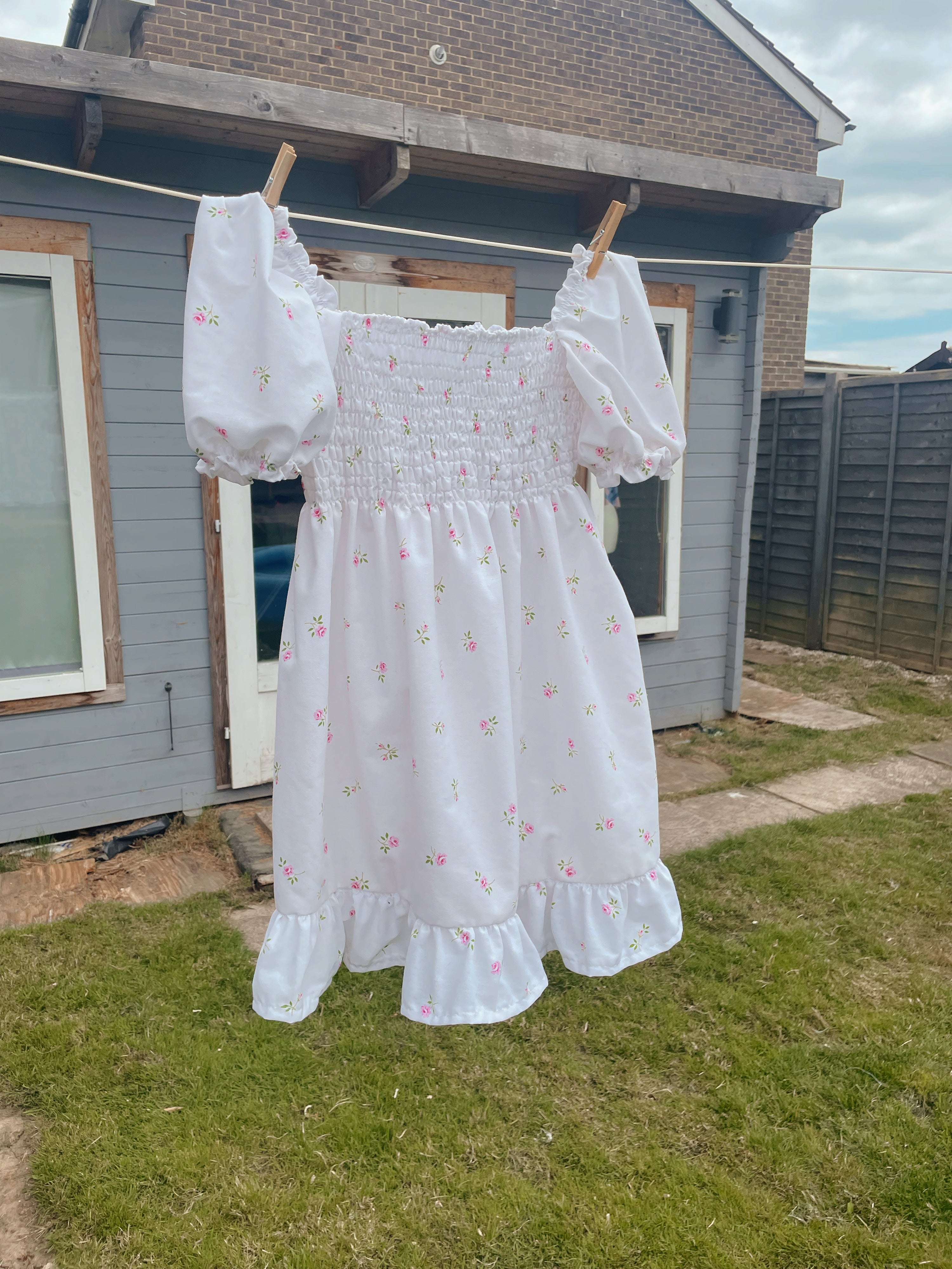 Jade babydoll mini dress in Rose Garden