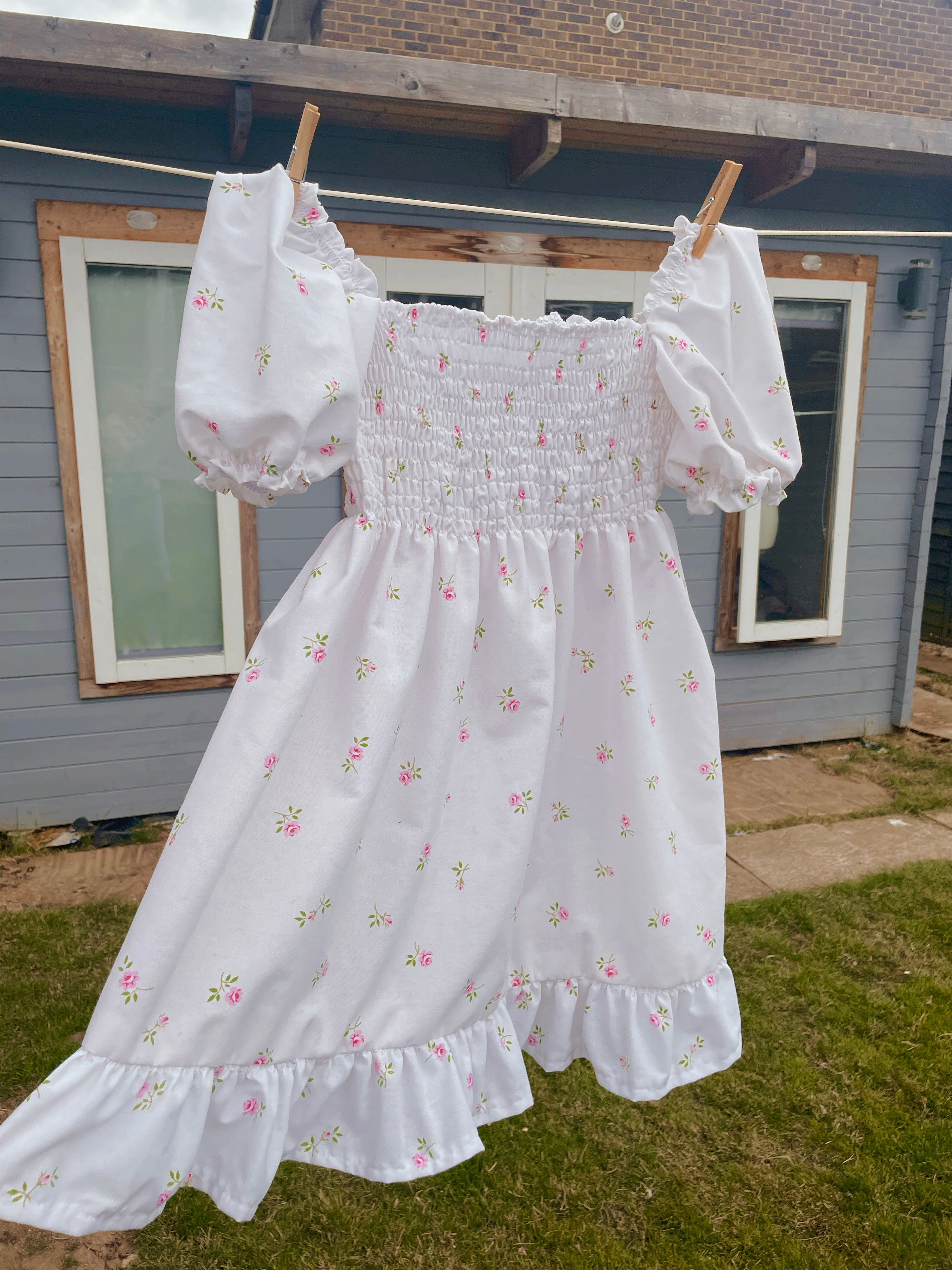 Jade babydoll mini dress in Rose Garden